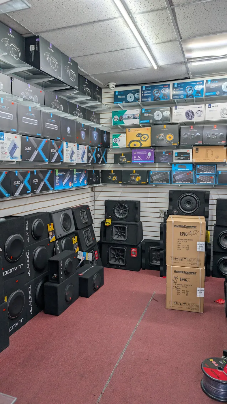 Bass room with JL Audio and Kicker loaded enclosures and AudioControl amps