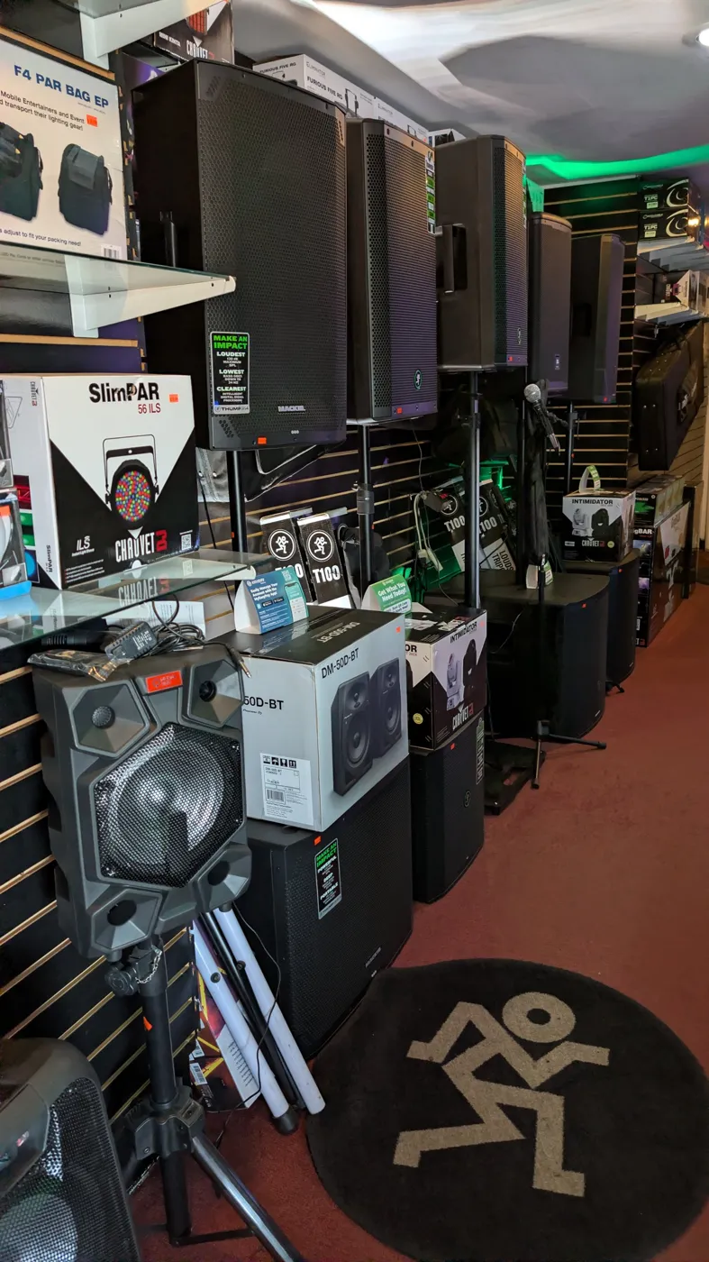 Mackie Thump speakers, Chauvet SlimPAR lights and PA gear on the DJ side