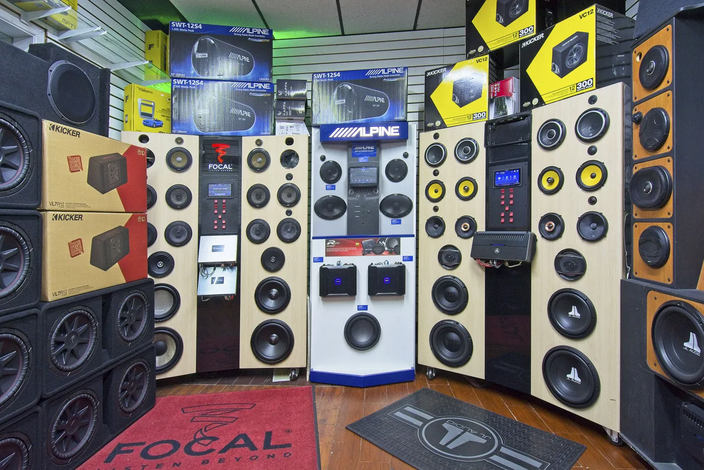Speaker and subwoofer display wall with Focal, JL Audio and Kicker at DJ Custom Audio